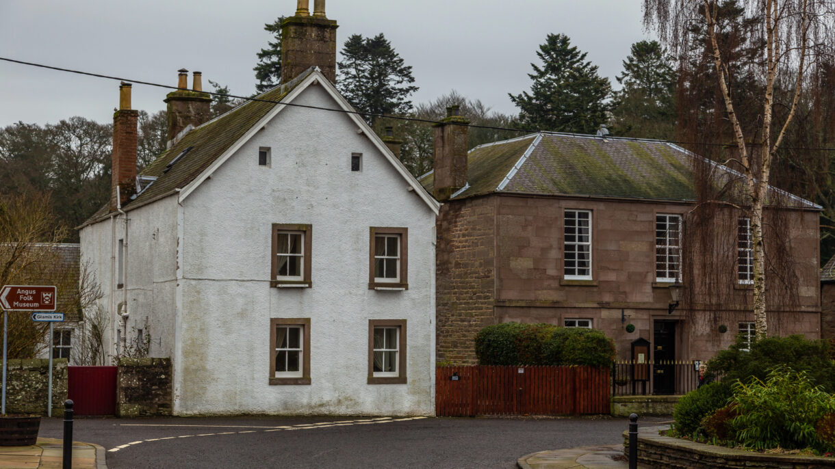Building in Scotland showing damp staining below guttering
